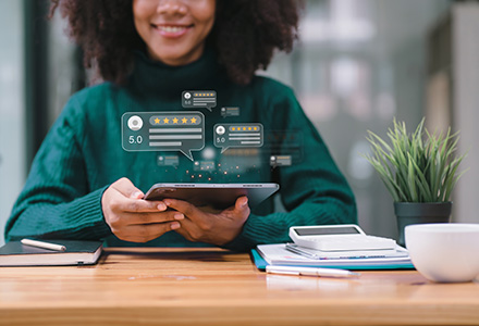 Customer on tablet providing five-star satisfaction ratings
